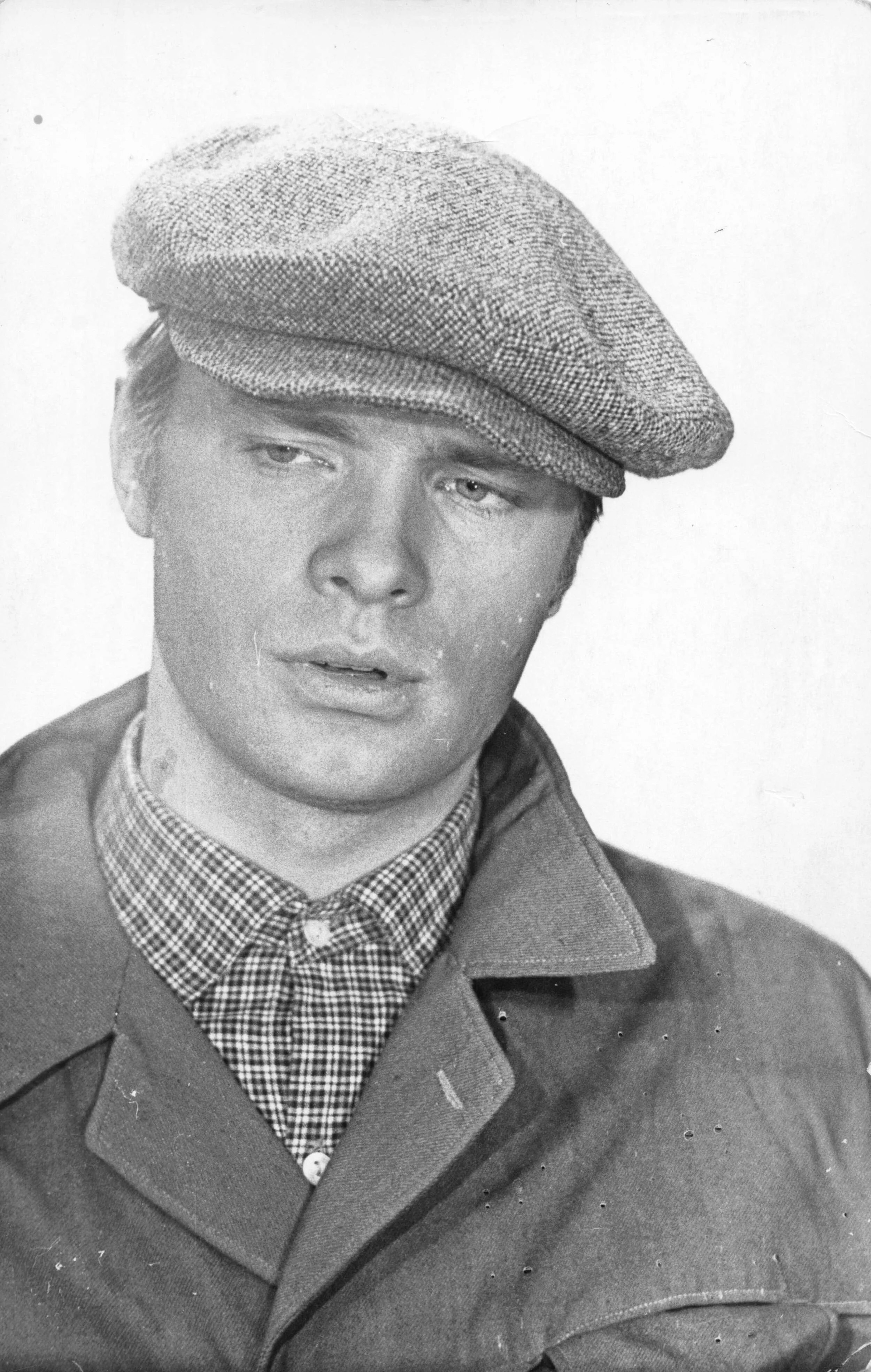 Oleg Vidov in a flat cap